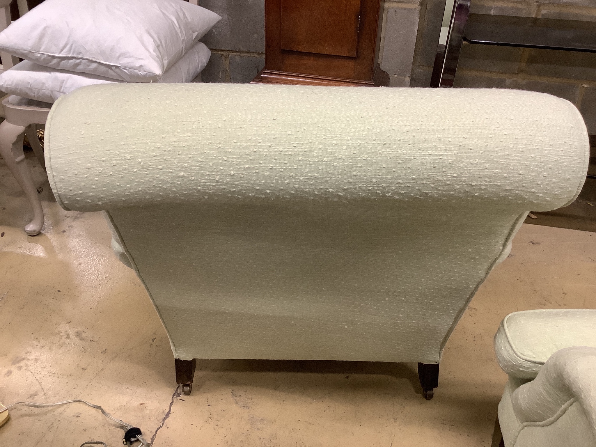 A pair of Howard style armchairs upholstered in lime green fabric. W-70, D-94, H-80cm.